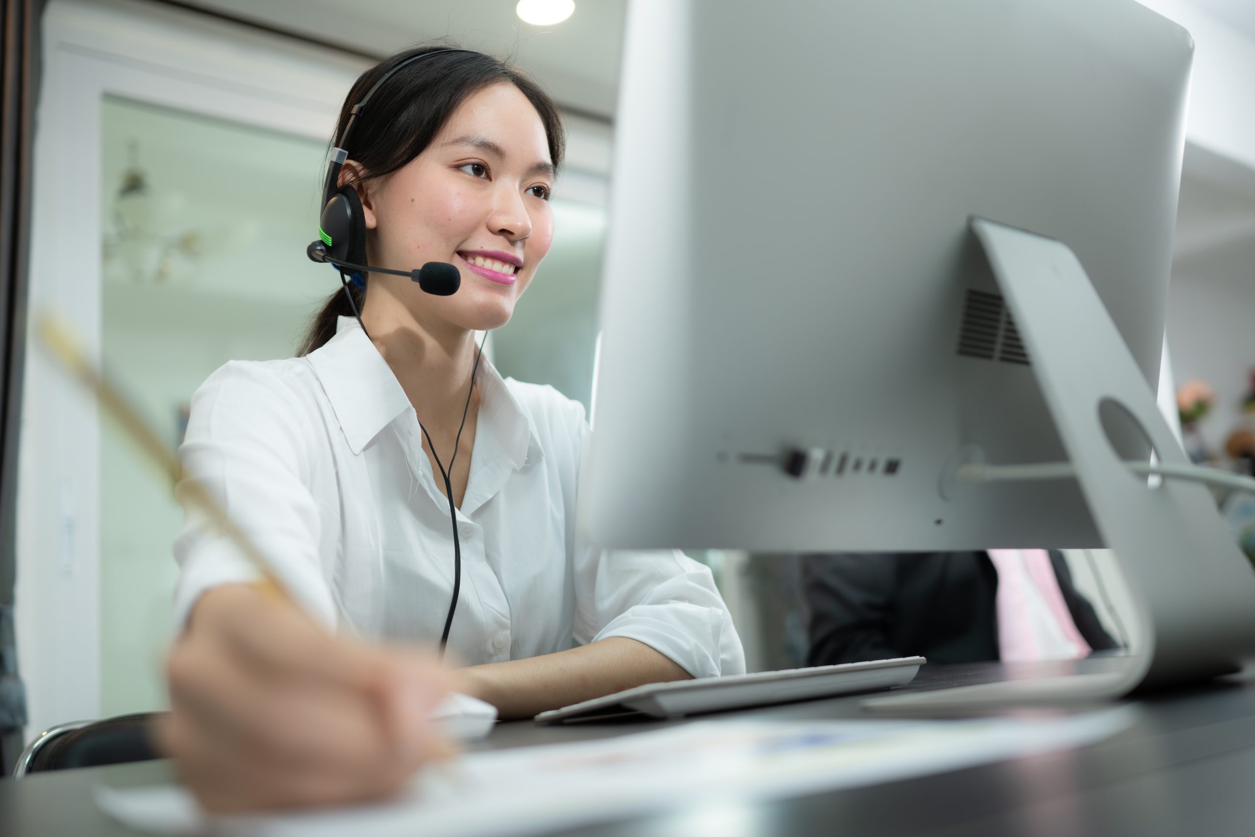 Portrait of business people wearing headset working actively in